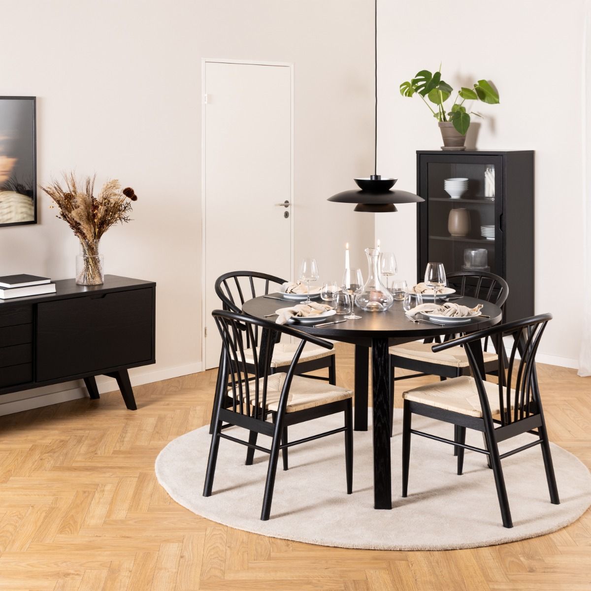 Montreux Round Extending Dining Table in Black 115-154cm includes 4 Cassandra Dining Chairs with Armrest in Black